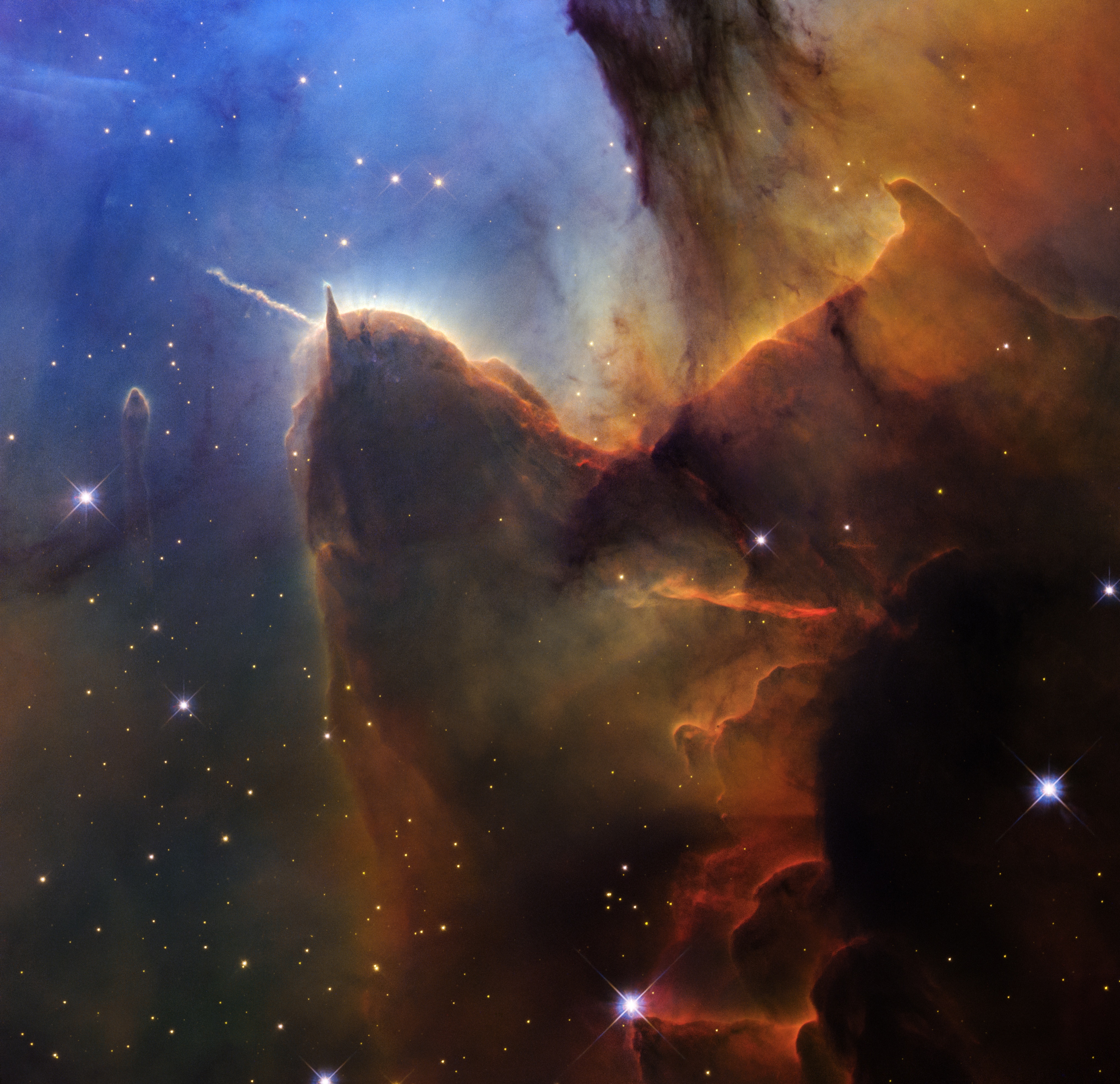 Nebulosa Trífida: O Espetáculo da Gênese Estelar e o Legado Contínuo do Hubble